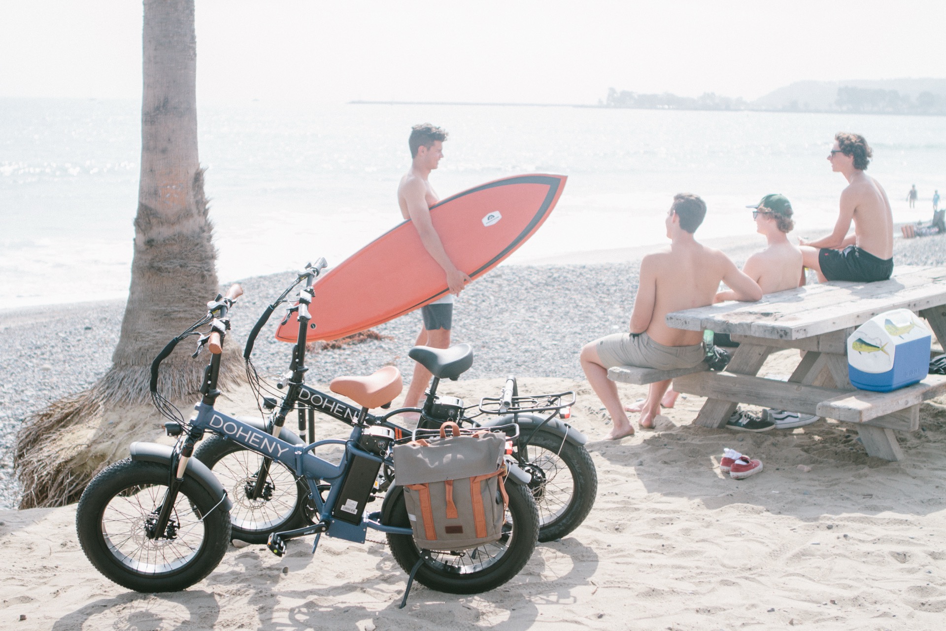Friends with Doheny bikes and surfboard